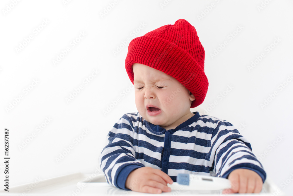 The baby sneezes with thermometer The baby sneezes with thermometer
