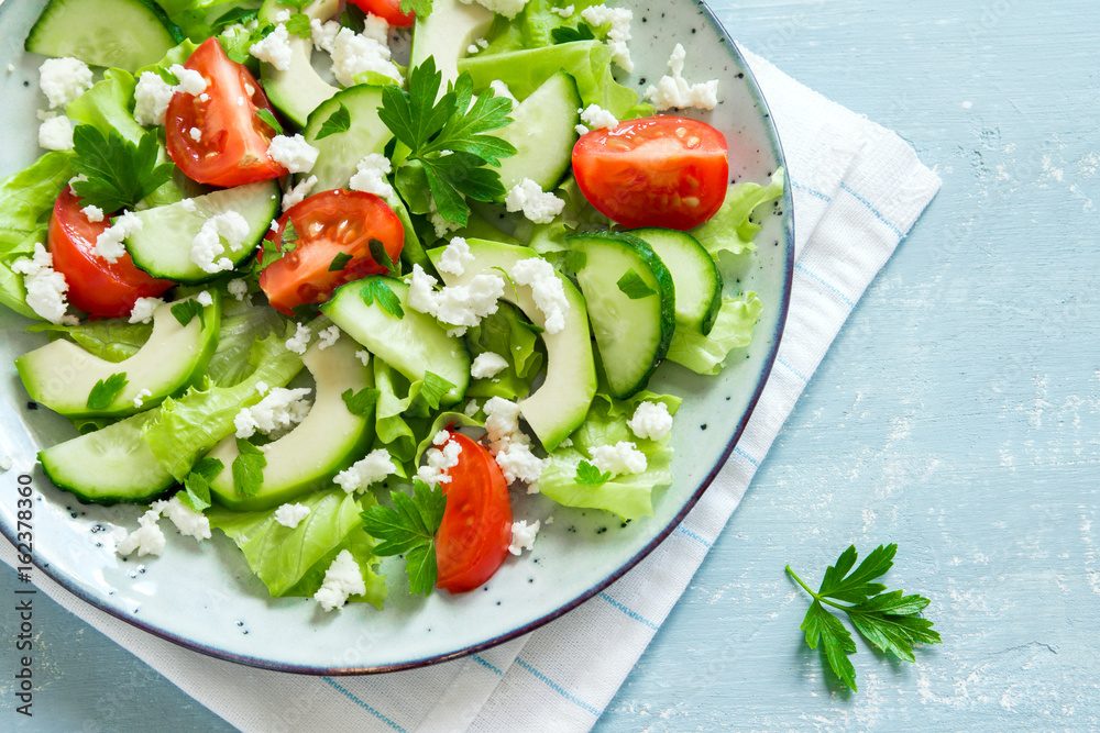 Green salad with avocado and feta Green salad with avocado and feta
