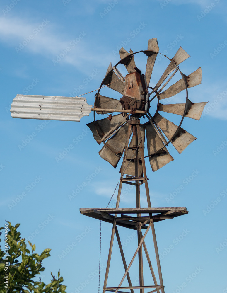 Wind wheel in Australia on a blue sky background Wind wheel in Australia on a blue sky background