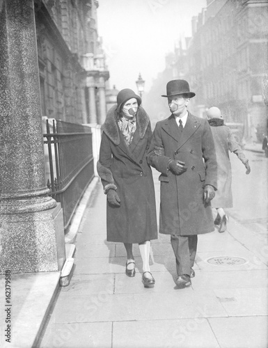 Couple with Flu Masks. Date: 1929 photo