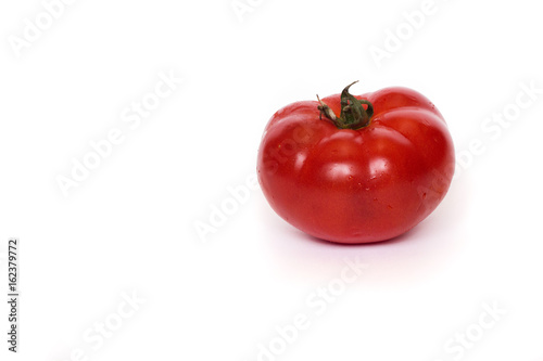 One tomato isolated on white background red