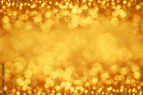  Abstract blur gold bokeh lighting from glitter texture for festive background
