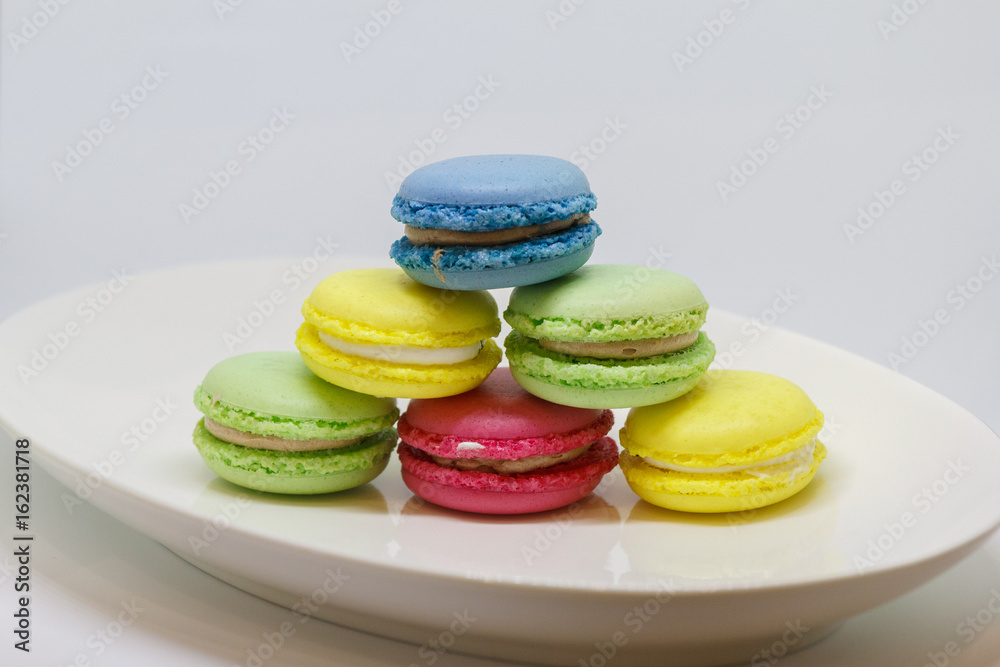 Sweet and colourful french macaroons or macaron on white background, Dessert.