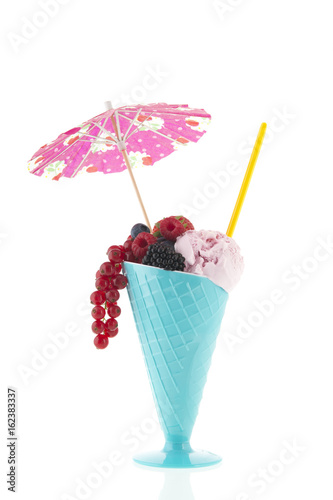 Glass with ice cream and fruit of the forest photo