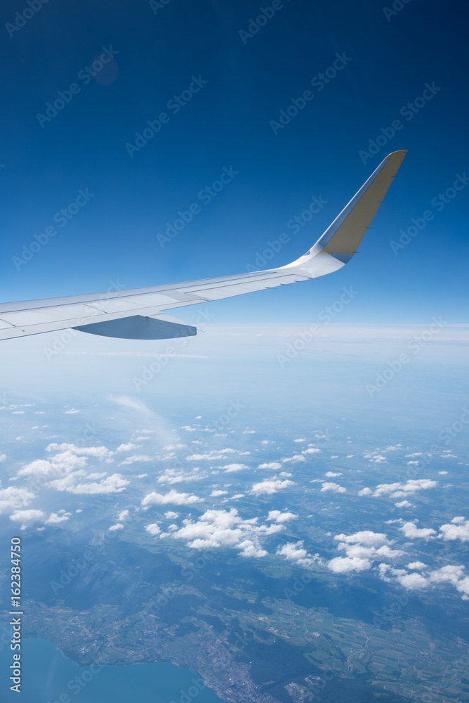 Landscape with a plane wing shot out of a plane window Landscape with a plane wing shot out of a plane window