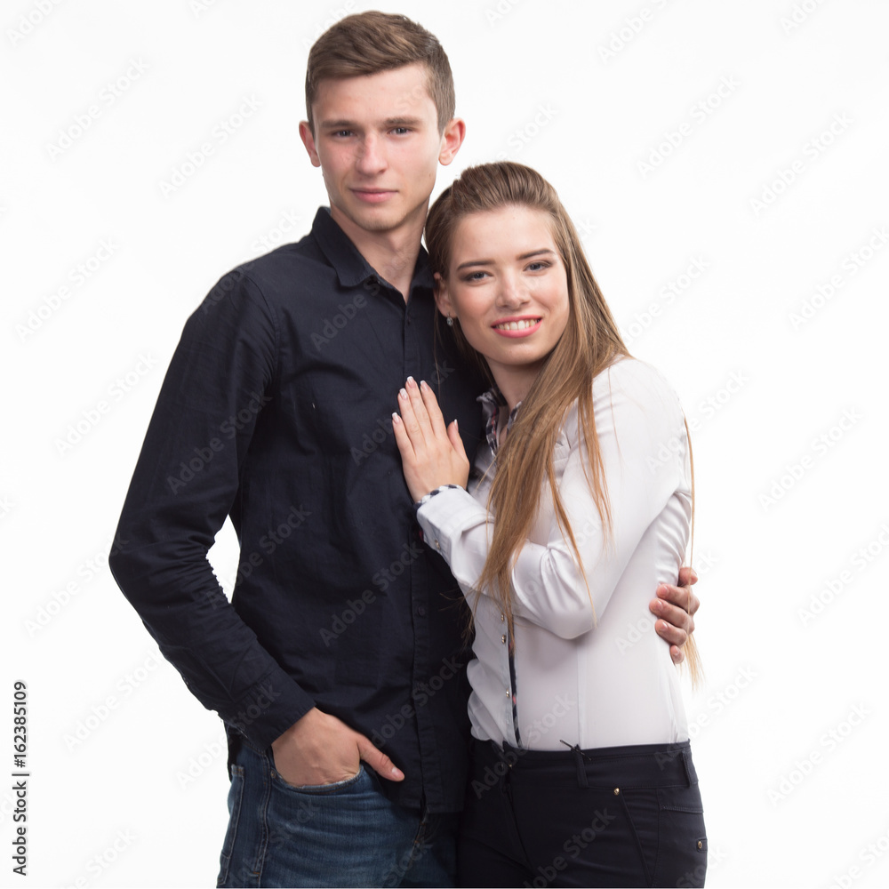 Young happy couple portrait of a confident businessman on a gray background. Ideal for banners, registration forms, presentation, landings, presenting concept. Young happy couple portrait of a confident businessman on a gray background. Ideal for banners, registration forms, presentation, landings, presenting concept.