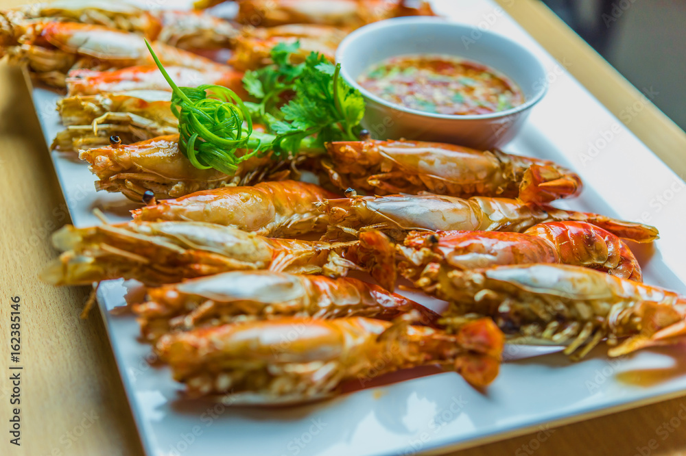 Grilled shrimps served on the table.