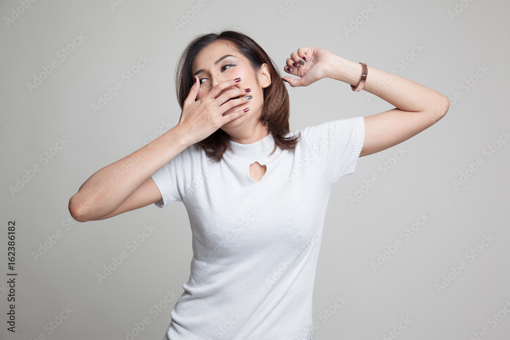 Sleepy young Asian woman yawn. Sleepy young Asian woman yawn.