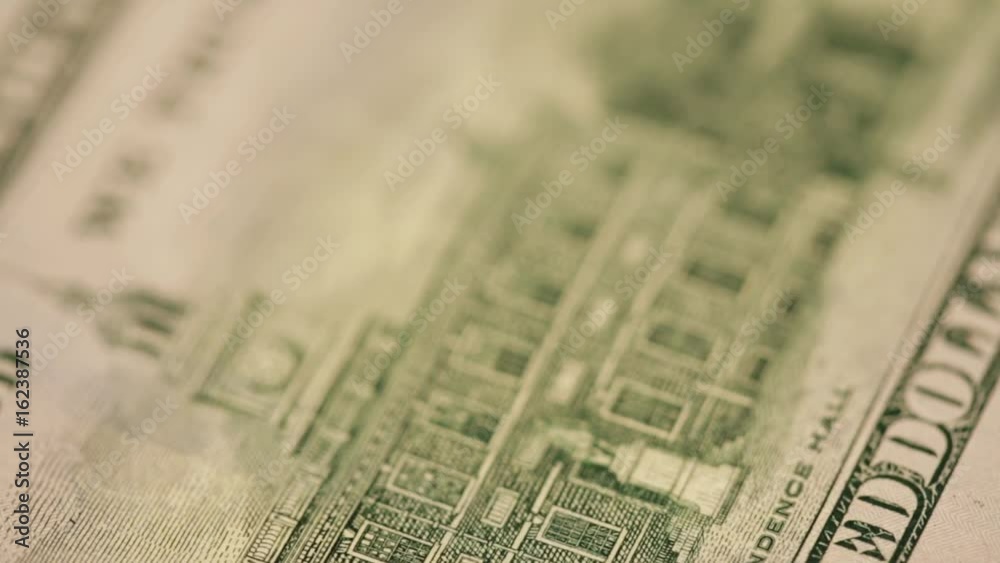 Cash money background. Benjamin Franklin portrait on 100 US dollar bill close up Cash money background. Benjamin Franklin portrait on 100 US dollar bill close up