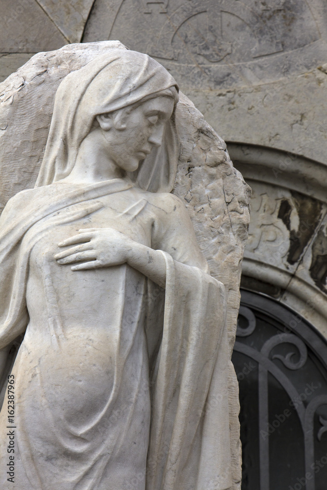 Statue of a classical female in cemetery