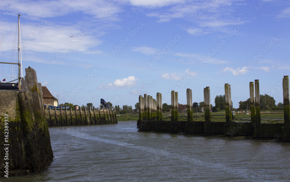 The dredged deep water channel and quayside at Bosham Harbour in West Sussex England