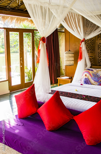 Interior of luxury tropical bedroom photo