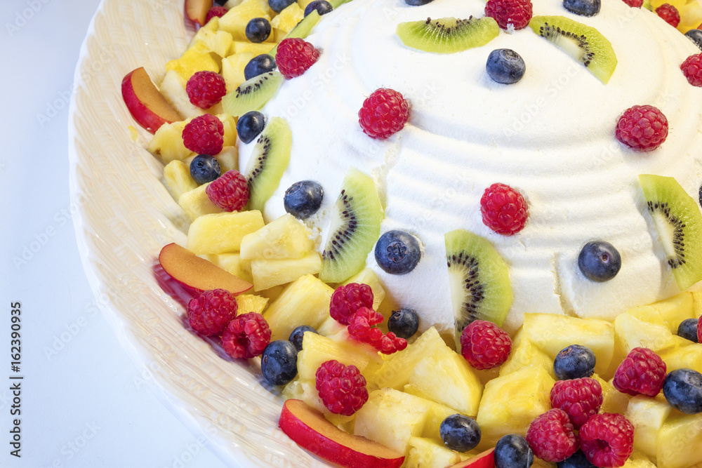 Cheese mousse with several piece of fruits such as berries, cranberries, pinneaple, kiwi Cheese mousse with several piece of fruits such as berries, cranberries, pinneaple, kiwi
