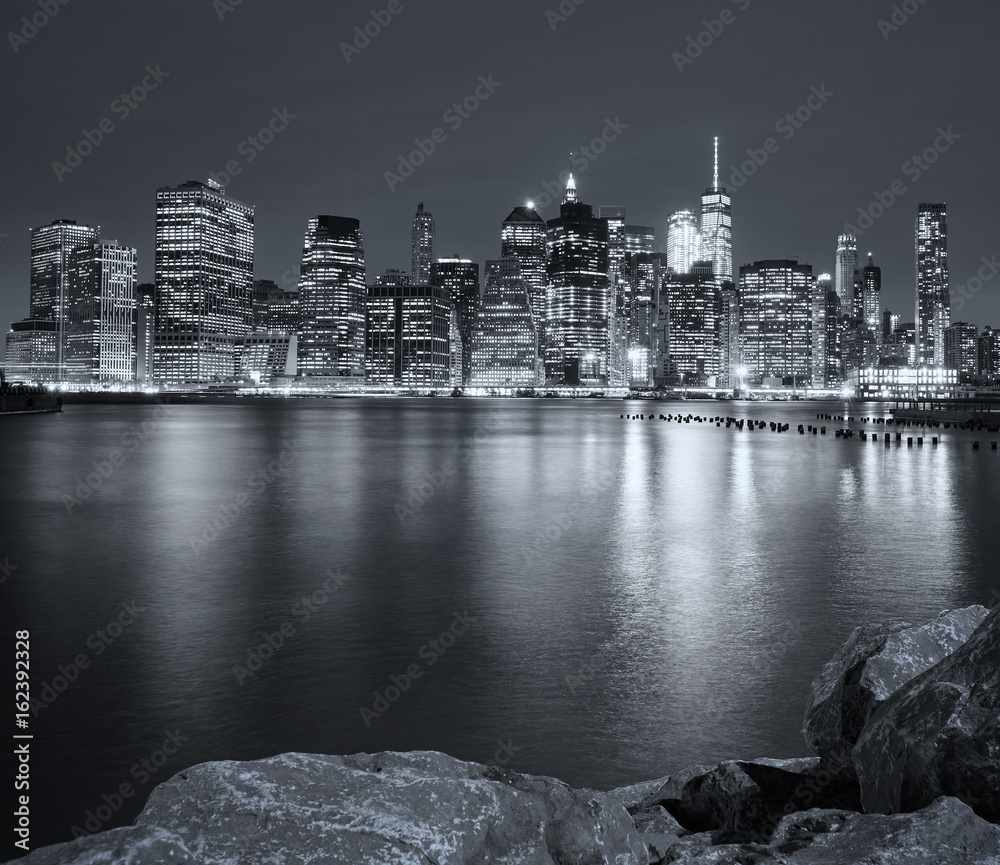 Black and white picture of New York City night skyline, USA.