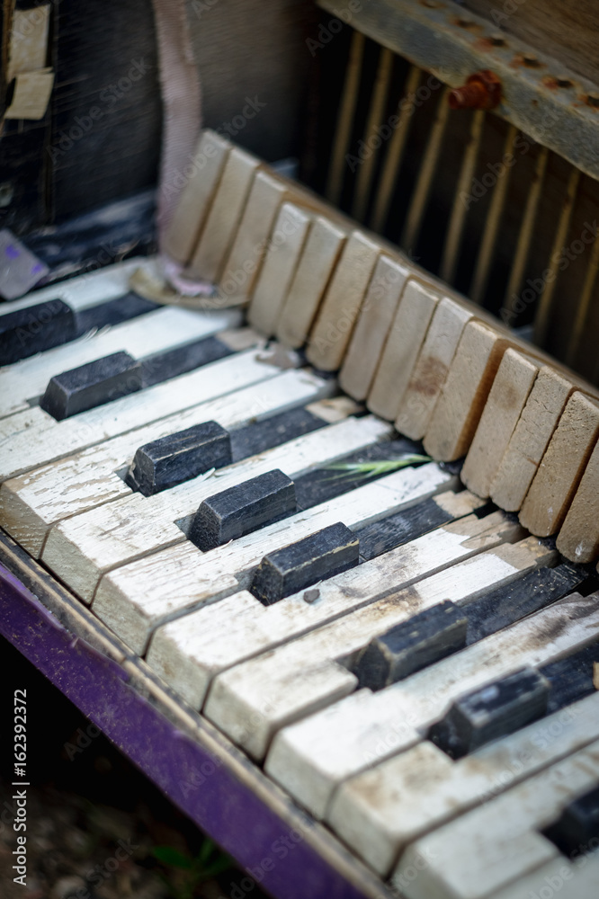 Old broken child piano on the street Old broken child piano on the street