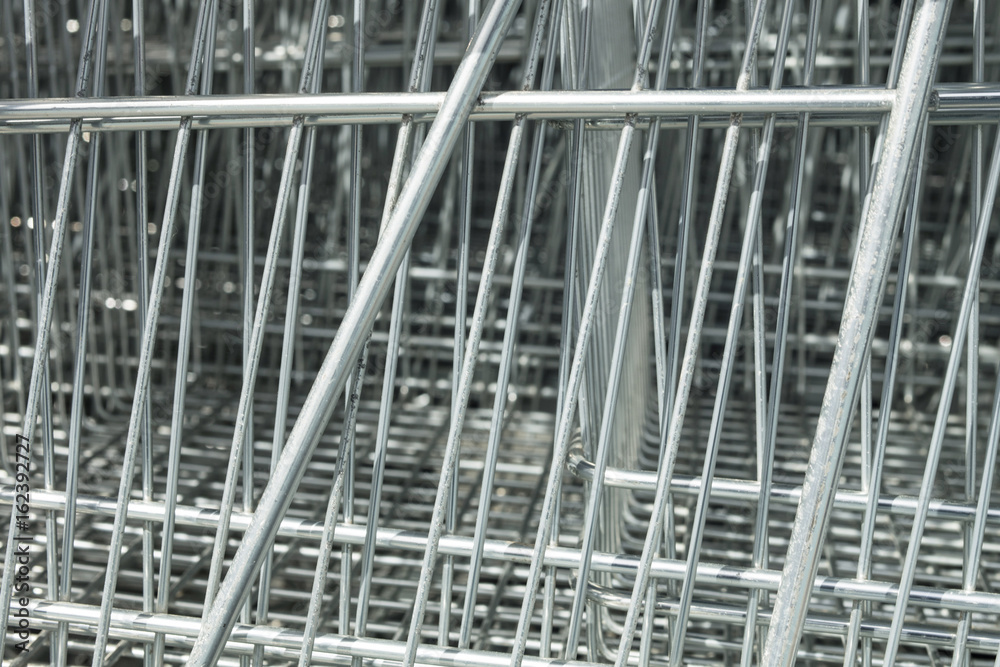 Geometric texture with bars of shopping carts placed together