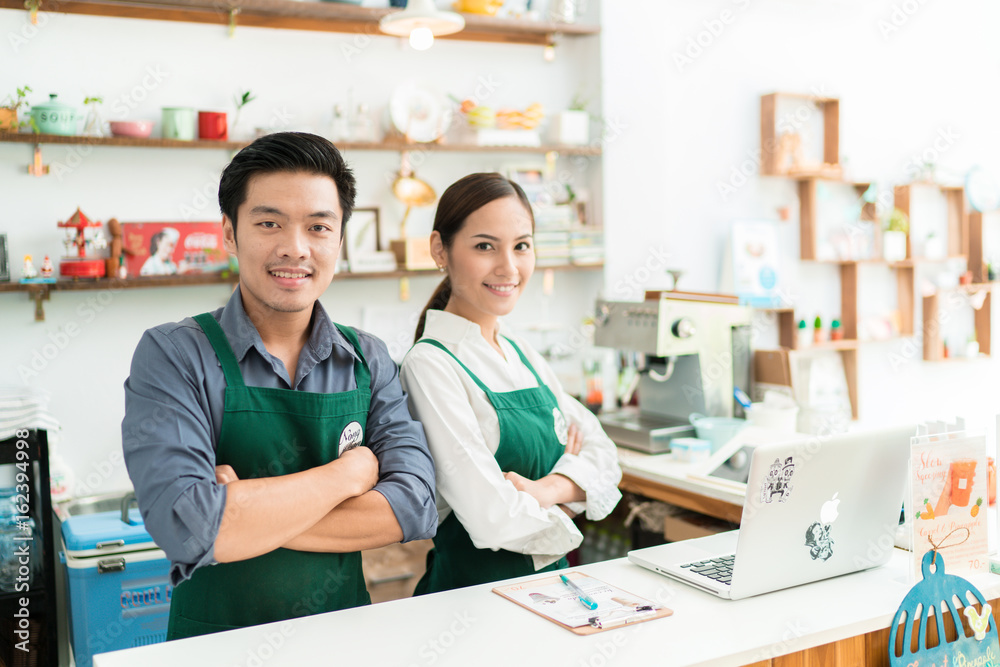 Asian barista is making coffee at his restaurant. And own a coffee shop Asian barista is making coffee at his restaurant. And own a coffee shop