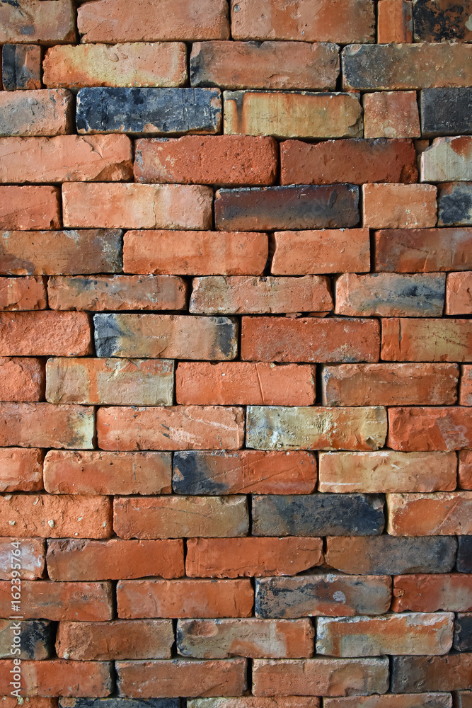 Obraz premium Rough brown brick wall background texture