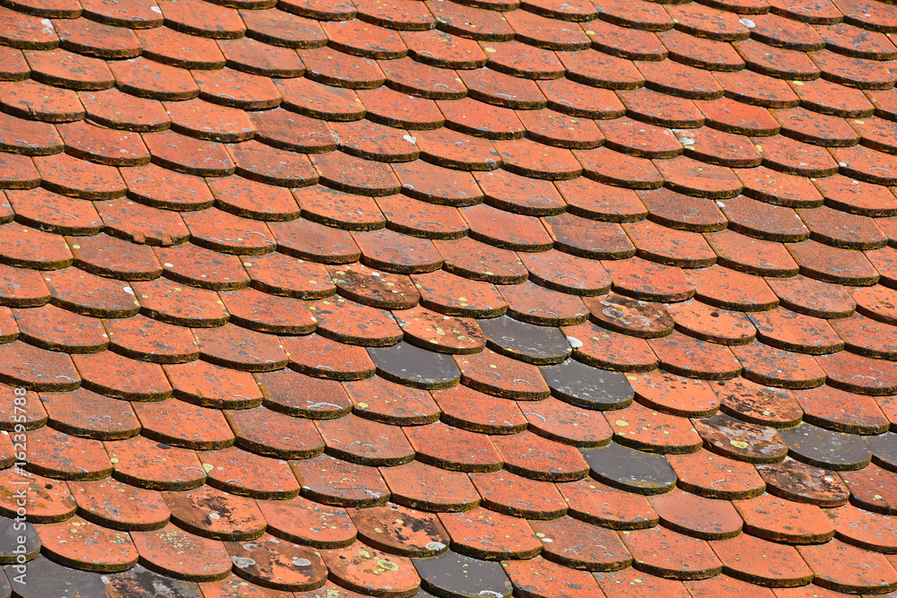 Old weathered red brown ceramic roof tiles Old weathered red brown ceramic roof tiles