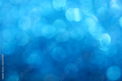 Blue winter bokeh lights abstract background