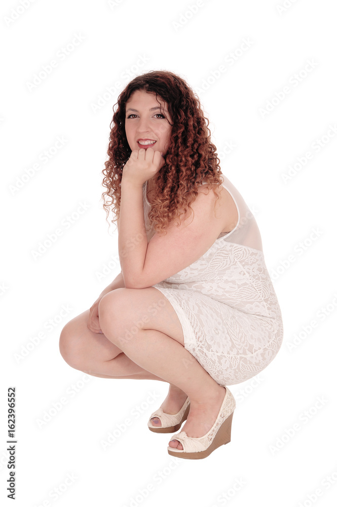 Obraz premium Woman crouching on the floor.