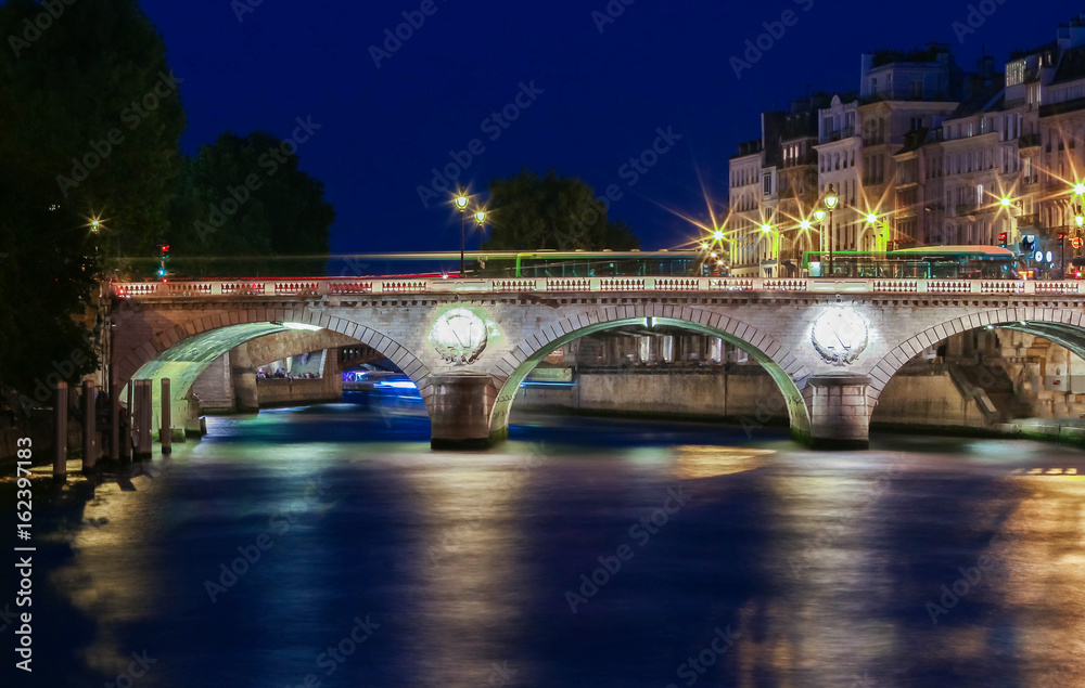 The pont( bridge) Saint- Michel at night, Paris, France.
