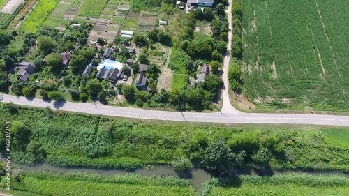 A flight from a bird's-eye view over the Russian village in the Kuban. Countryside, houses and gardens. photo