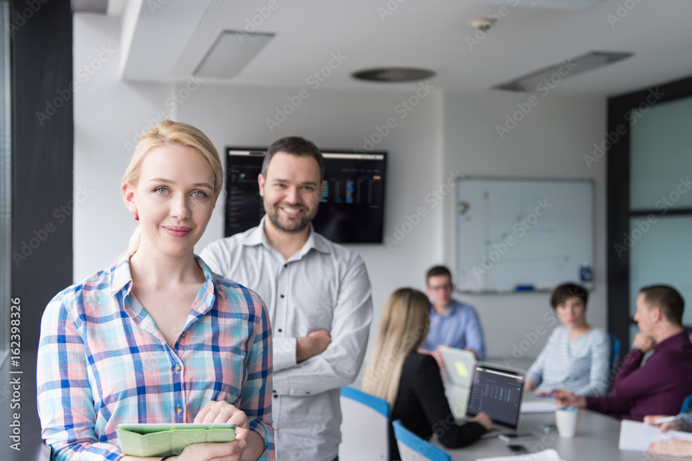 Business People Working With Tablet in startup office Business People Working With Tablet in startup office