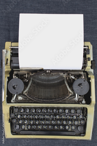 The writer's hands on a typewriter begin to write