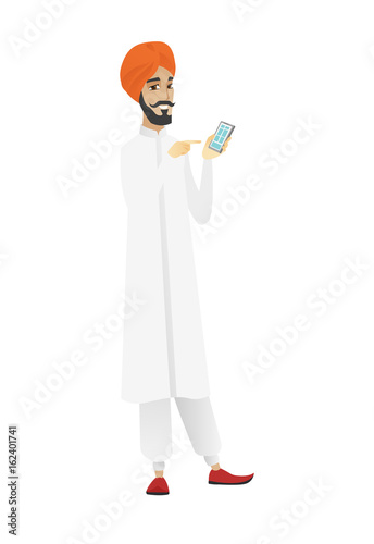 Hindu businessman holding a mobile phone.