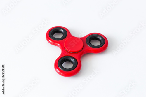 close up of popular toy fidget spinner over white