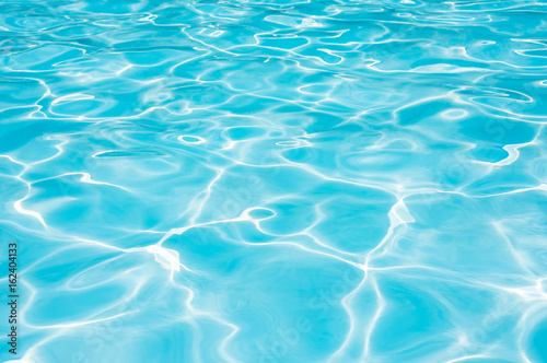 Beautiful ripple wave and blue water surface in swimming pool © peangdao