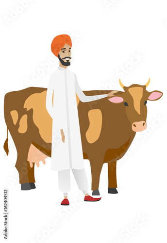 Farmer standing with crossed arms near cow.