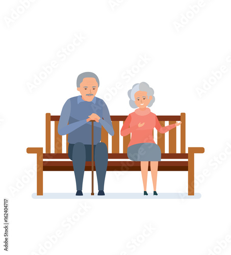 Lovely elderly couple sitting on a bench, they relax, communicate.