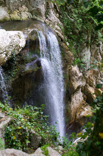 Waterfall in green subtropical mountains