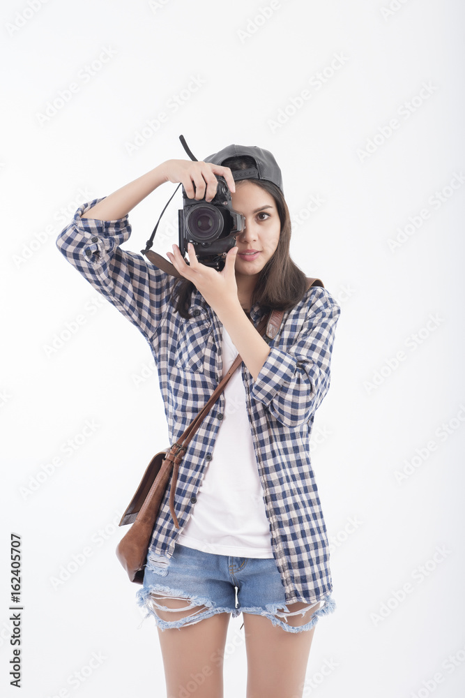 Beautiful travel girl with camera isolated on white background Beautiful travel girl with camera isolated on white background