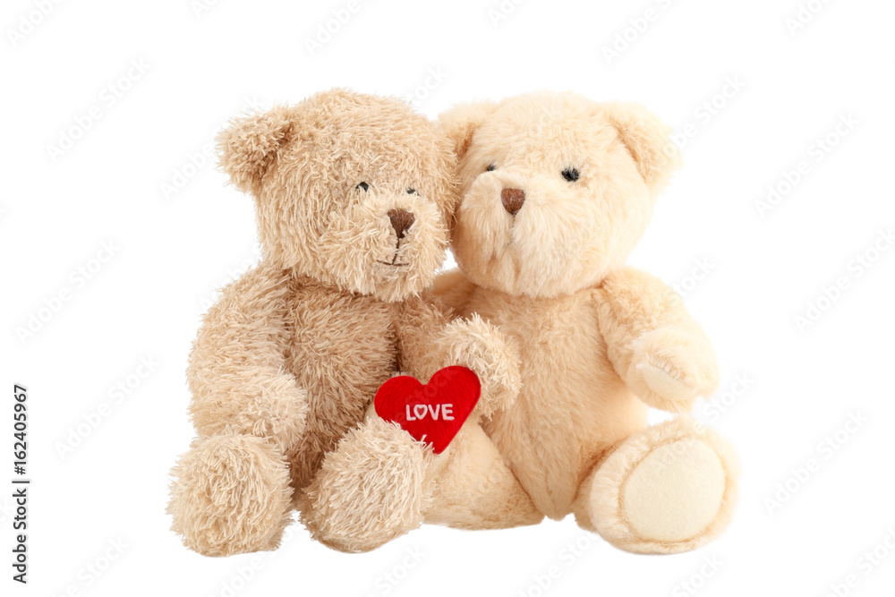 Light brown teddy bears with red heart isolated on white background. Valentine's Day. Light brown teddy bears with red heart isolated on white background. Valentine's Day.