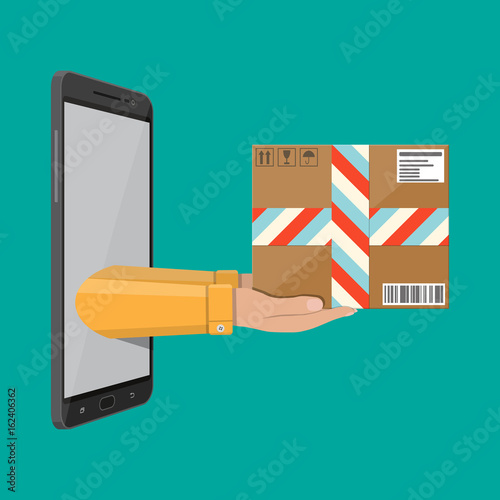 Hands with postal cardboard box and smartphone.