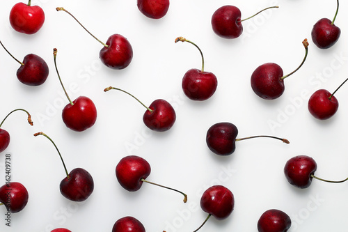 Red ripe sweet cherries on a white background