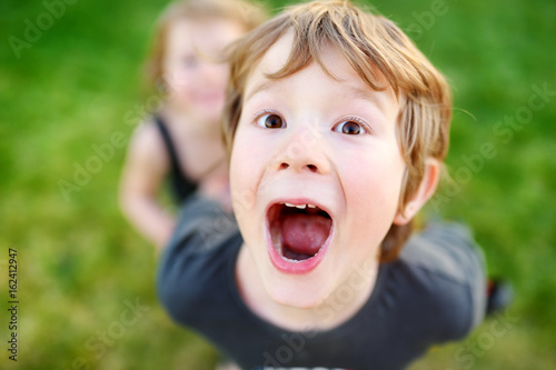 Funny little boy shouting and making funny faces © MNStudio