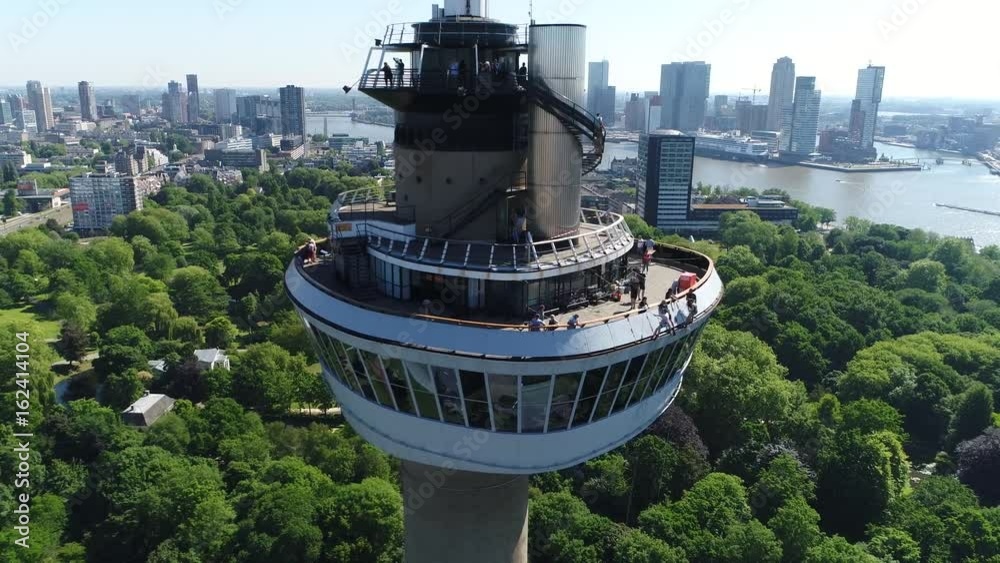Aerial footage flying backwards from Euromast an observation tower in Rotterdam Netherlands it was specially built for the 1960 Floriade and is a listed monument since 2010 4k high resolution