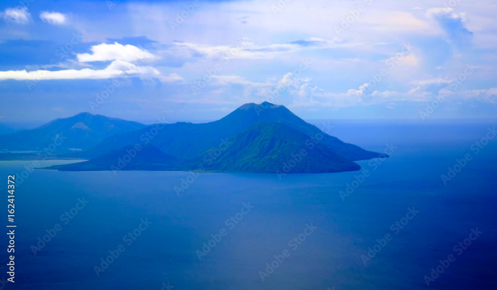 Aerial view to Tavurvur volcano at Rabaul, New Britain island, Papua New Guinea