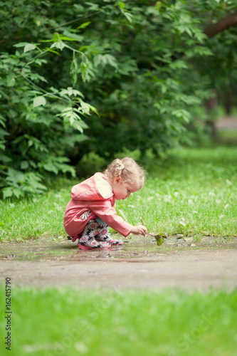 Little beautiful girl walking in a summer park © rimmdream