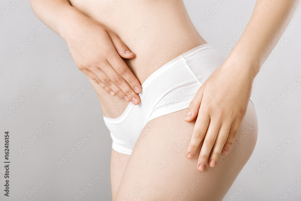 Perfect sports body of woman in white lingerie. Slim female shape Perfect sports body of woman in white lingerie. Slim female shape