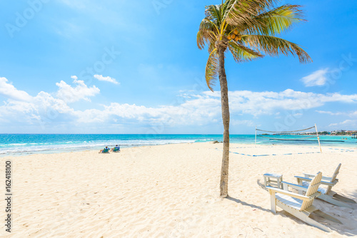 Relaxing on chair at paradise beach and city at caribbean coast of Quintana Roo, Mexico © Simon Dannhauer