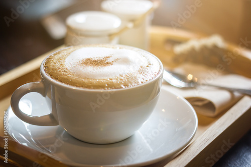 Soft focus on capuccino coffee cup, coffee for background - vintage effect process picture photo