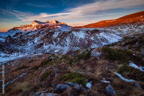 Fototapeta Naklejka Na Ścianę i Meble -  the top of the snow-capped mountain at sunrise