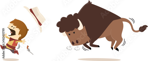 Bison sauvage poursuivant un cow-boy