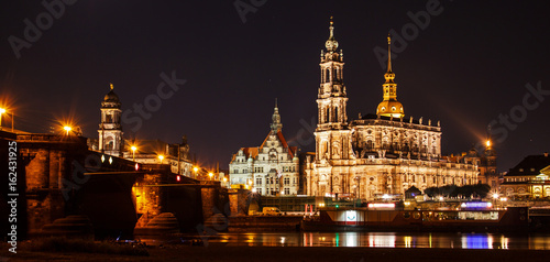 Night summer beautiful panoramic view of Cathedral of the Holy Trinity or Hofkirche, Bruehl's Terrace or the Balcony of Europe on Elbe river, Dresden, Saxony, Germany, Europe.
