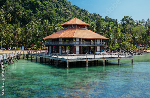 Wooden jetty on exotic beach